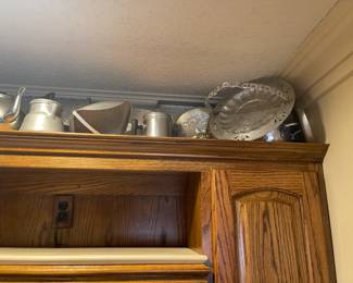 Dozens of hammered aluminum pieces.