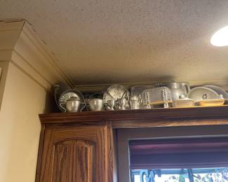 Dozens of hammered aluminum pieces.