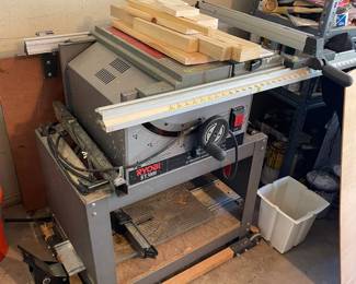Large table saw on stand. 