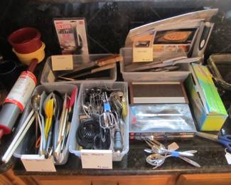 Lots of kitchen utensils and knives