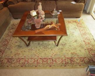 Kathy Ireland home, wool area rug, and a great coffee table with a beveled glass insert and metal legs