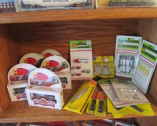 Vintage collector trains and accessories are still in the boxes.