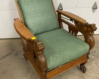 EARLY OAK CARVED MORRIS CHAIR