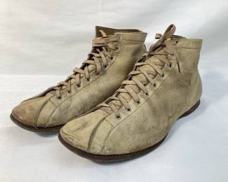 BIHY900 Antique Mens Athletic Shoes A pair of antique men's athletic shoes. The shoes are crafted from leather, and were most likely used for basketball or bowling.&nbsp;
