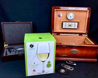 RUVE942 Thompson Company Humidor More Thompson Co., Inc., since 1915 handmade wooden inlay with cedar lined interior humidor, no keys. &nbsp;2 cigar cutters, lighter needs fuel.
