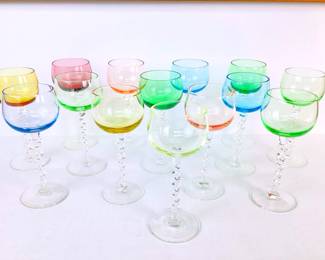 MACH964 Hand Blown Twisted Stem Goblets 14 glasses, 1 green glass shows very visible uranium in glass, other colors show light glow rings around rims.
