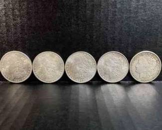 SHBR707 Morgan Silver Dollars A collection of 5 civil war era United States Morgan silver dollars. Mint years include 1884, 1885, 1886, 1887, and 1921.&nbsp;
