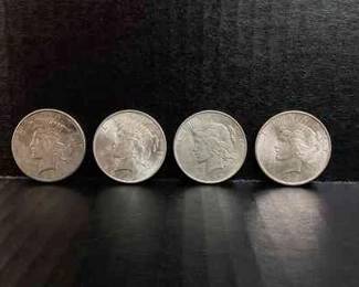 SHBR706 1920s Liberty Silver Dollars A collection of 4 Liberty Silver Dollars, minted in the 1920s. Mint years include 3 coins that were minted in 1922, and 1 coin minted 1926S.&nbsp;
