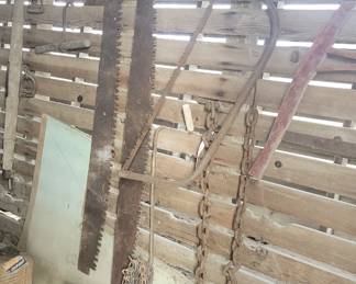 Two man saws, chains, misc