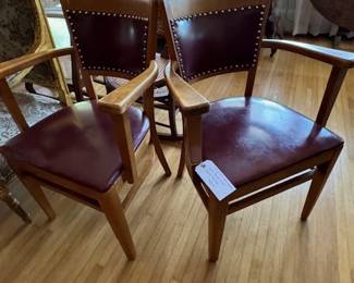 Pair of nice vintage arm chairs with dark red leather and brass tacks