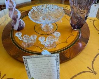 2 beautiful Murano vase on top of the round Italian dining table.
