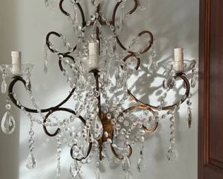 Stunning pair of vintage crystal sconces.  They are currently not connected to the wall and appear to be re-wired.  All crystals are intact, excellent condition.