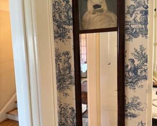 Antique mirror with painting of little girl, presumably painted on glass at the top.  