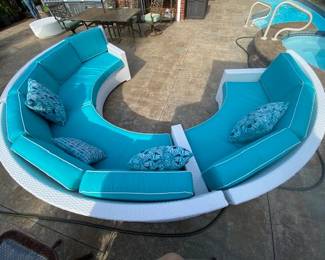 New Frontgate circular sectional, white wicker, outdoor sofa with sunbrella cushions and pillows.  Custom frontgate round coffee table (not shown) to be sold with.  Priced at 1/2 of retail.    