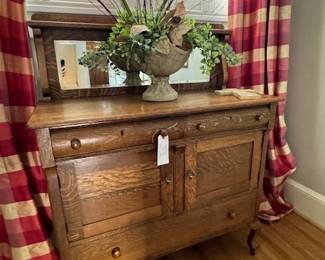 Early American Oak buffet in good condition with storage and silverware drawers with mirrored back,  Great find!