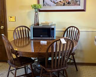 54” round oak pedestal table and chairs