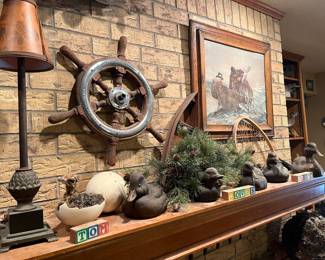 ships steering wheel and duck decoys