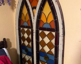 colorful, arched stained glass window from church