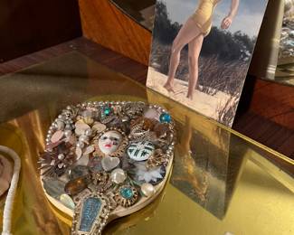bejeweled hand mirror and 1940s pinup