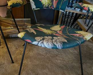 wrought iron armchair with floral cushion