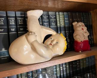 rolling baby and pig chalkware figurines
