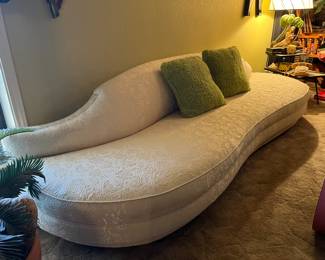 white contoured sofa couch in pristine condition