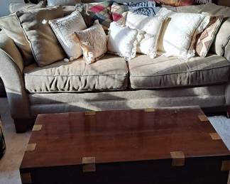 Lane Cedar Chest with Brass Detail; Tan Sofa; Decorative Pillows; Assorted Prints many with African Animals