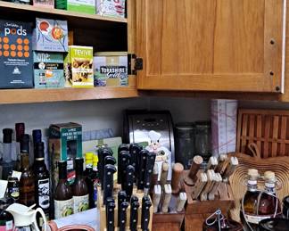 Large assortment of knives, canisters, tea pots, and tea!!!!