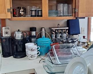 This kitchen is packed with cookware, bakeware, serving ware, dinner ware, coffee pots, mugs, cups, Tea Pots, and glassware!