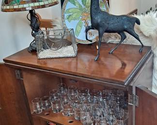 Mid Century Modern Wood Mini Bar; Drink ware; Bottle Coolers; Leaded Stained Glass Table Lamp; Heavy Iron Reindeer; Palm Tree Plate and so much more!