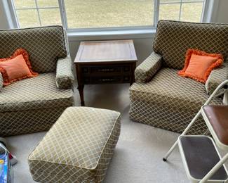 two matching upholstered chairs with one ottoman
