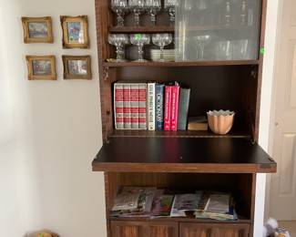 bookcase with sliding glass shelves on top