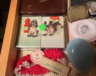 Display case items, Vulcan items, playing cards with RR ties, baby rattles, vintage lighters