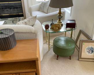 glass table top with one of the many lamps; green stool