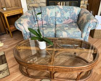 rAttan coffee table, loveseat w blue print upholstery