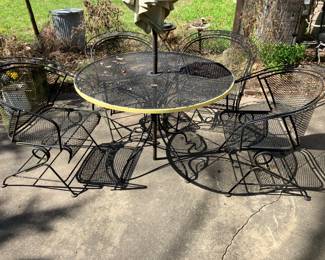 Wrought iron table w spring-base chairs