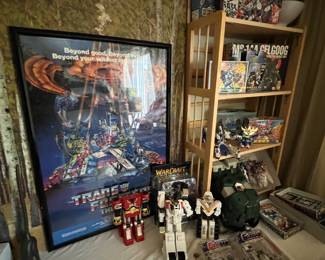 Framed Transformers movie poster and a great collection of various robot figures. 