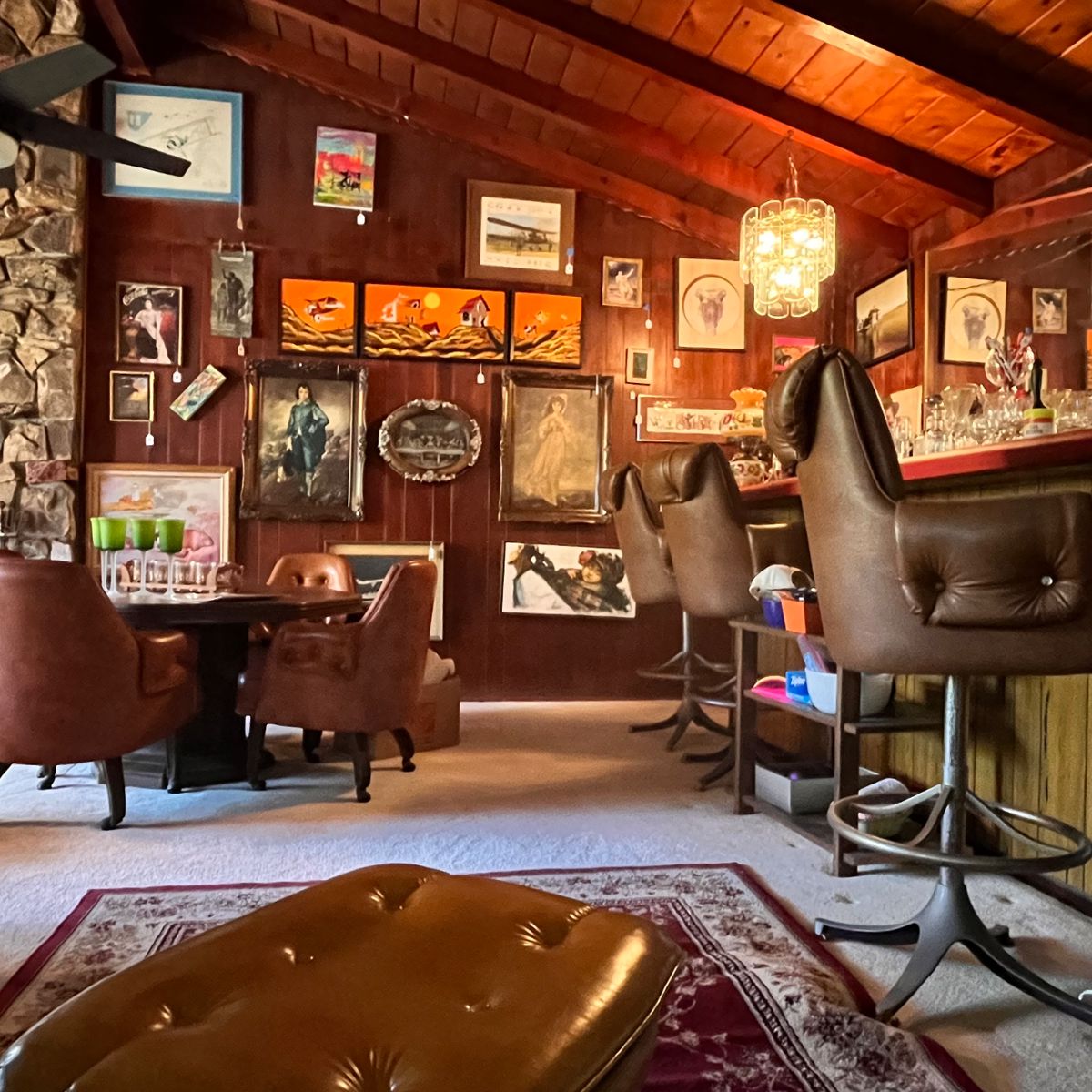 Gallery Wall w/low poker table, bar stools.