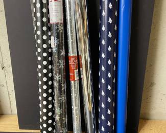 Assortment of black, silver, and blue wrapping paper,  was $9, NOW $7