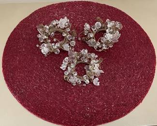 Burgundy beaded placemat,  was $8, NOW $6.  3 clear beaded napkin rings,  was $7, NOW $5