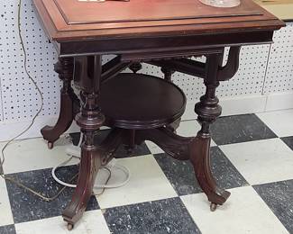 Parlor table with ornate bottom