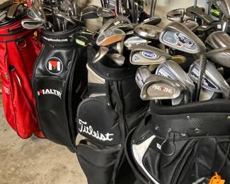 many golf bags & club s