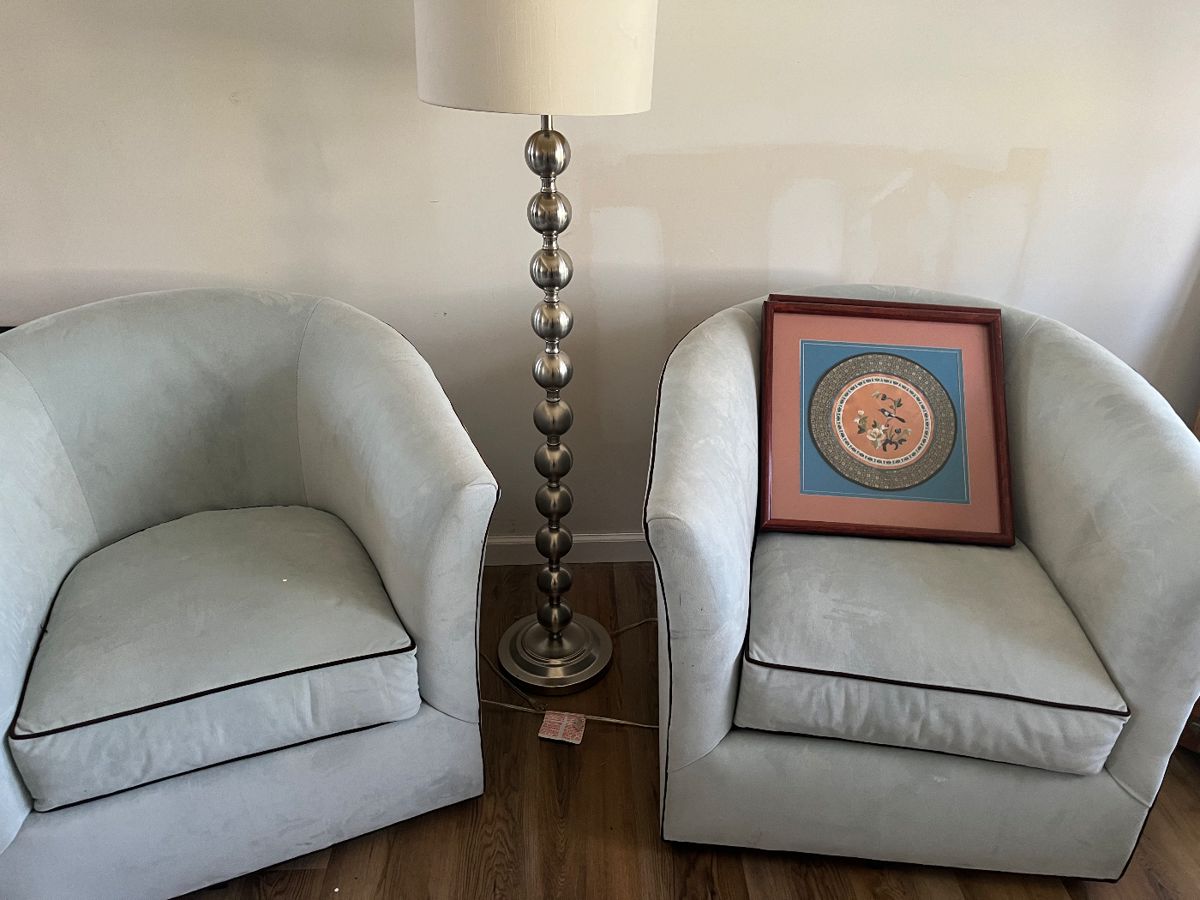 Pair of pale
Blue ultra suede swivel chairs 