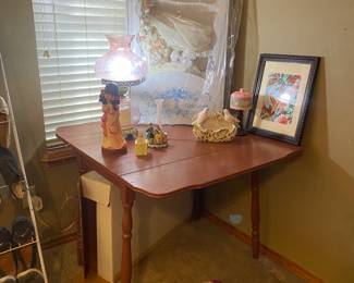 Drop leaf table, preserved wedding dress and beautiful pink crackled lamp 