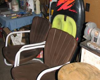 Vintage metal chairs water skis and board