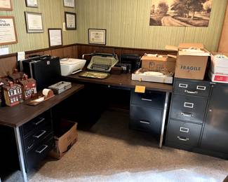 Antique typewriter and briefcases