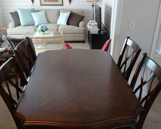 Ashley Dining room table with 4 chairs and 1 leaf