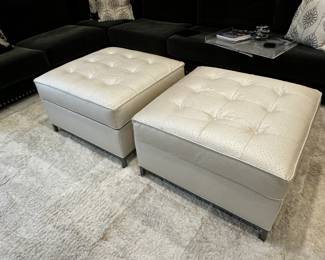 27) $500 - Set of two custom simulated leather stuffed ottomans with storage. 33" x 33" x 19".