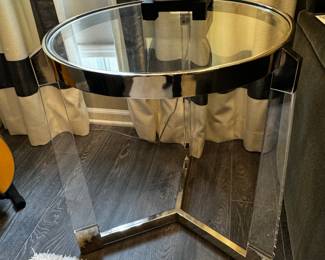 7) $50 - Round glass top and acrylic legged side table. 20" x 25".