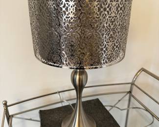 15) $60 - Silver lamp with metal overlay shade over gray shade. 15" x 15" x 25".